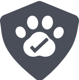 A dark gray shield with a white paw print in the center. Inside the paw print, a checkmark symbol suggests pet safety or approval—ideal for working dog outdoor gear or secure kennel branding.
