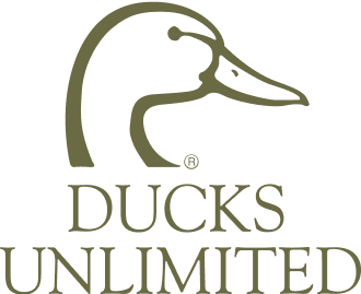 Logo featuring a simple outline of a duck’s head above the words “DUCKS UNLIMITED” in capital letters, evoking the spirit of the working dog. The design is in a muted green color on a light background.