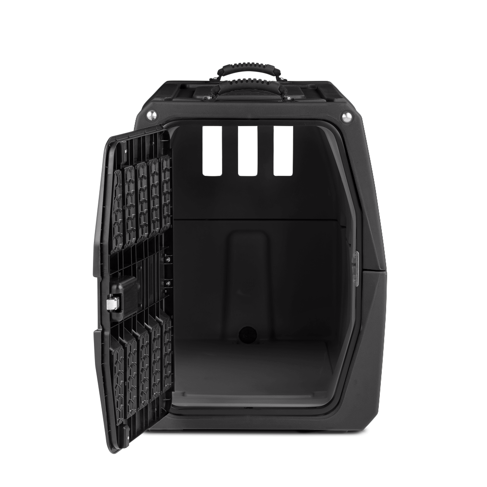 The GUNNER G1™ KENNEL - MOSSY OAK BOTTOMLAND BLACK is a black, hard-shell dog crate with a handle on top and rectangular ventilation holes near the roof, shown open against a white background—ideal for secure pet transport.