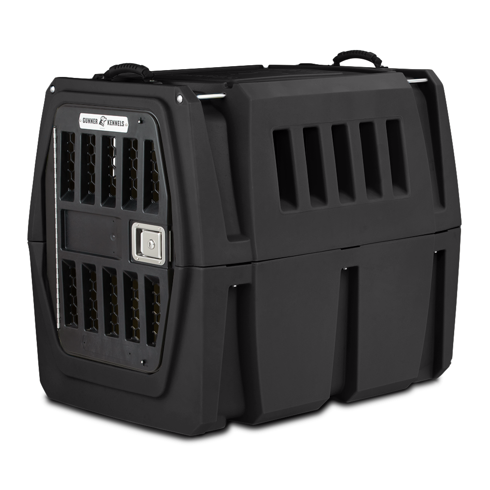 The GUNNER G1™ Kennel is a sturdy black plastic crate with vented sides, a metal door, secure latch, and handles. Its double-wall design offers shock protection, making it one of the safest dog crates for travel or home use.