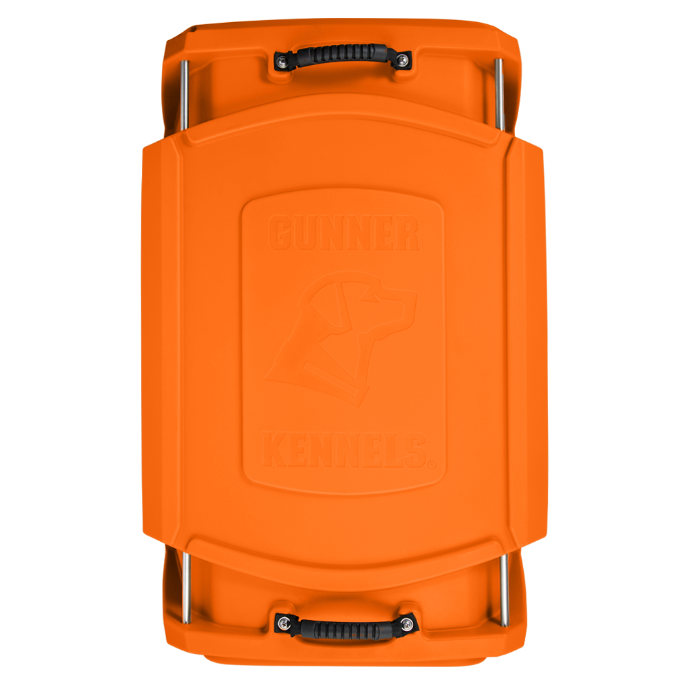 Top view of a G1™ KENNEL - BLAZE ORANGE hard plastic lid by GUNNER, featuring black handles, silver metal bars on each end, and an embossed dog head with the brand name.