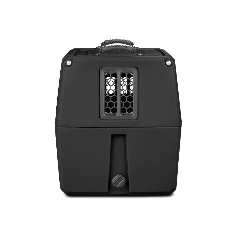 The GUNNER G1™ KENNEL - MOSSY OAK BOTTOMLAND BLACK is a black hard-shell dog crate with a top handle and hexagonal front vent, set on a plain white background—crafted for secure pet travel.