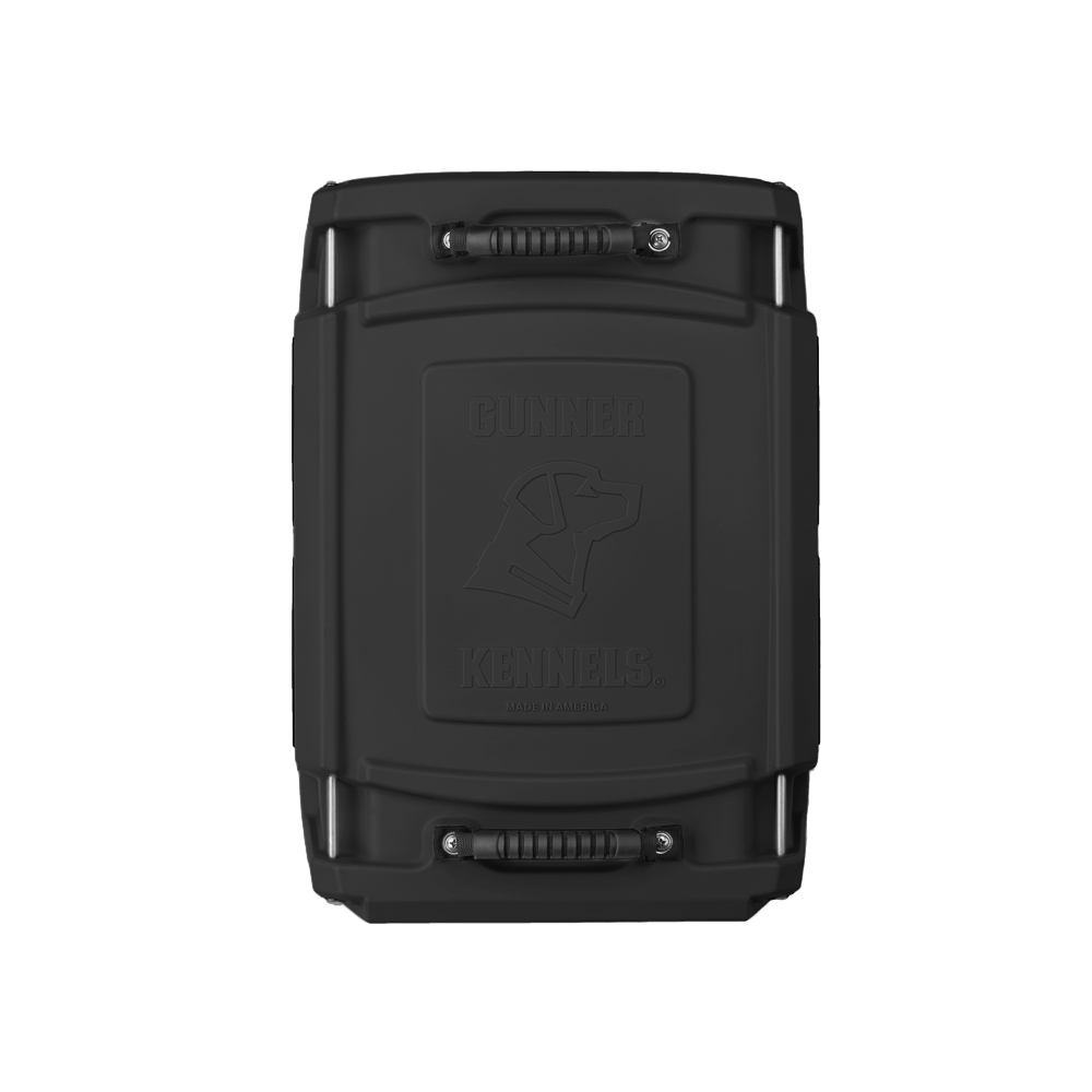 The GUNNER G1™ KENNEL - MOSSY OAK BOTTOMLAND BLACK is a durable black rectangular dog crate with two sturdy handles and an embossed dogs head with Gunner Kennels on the front.