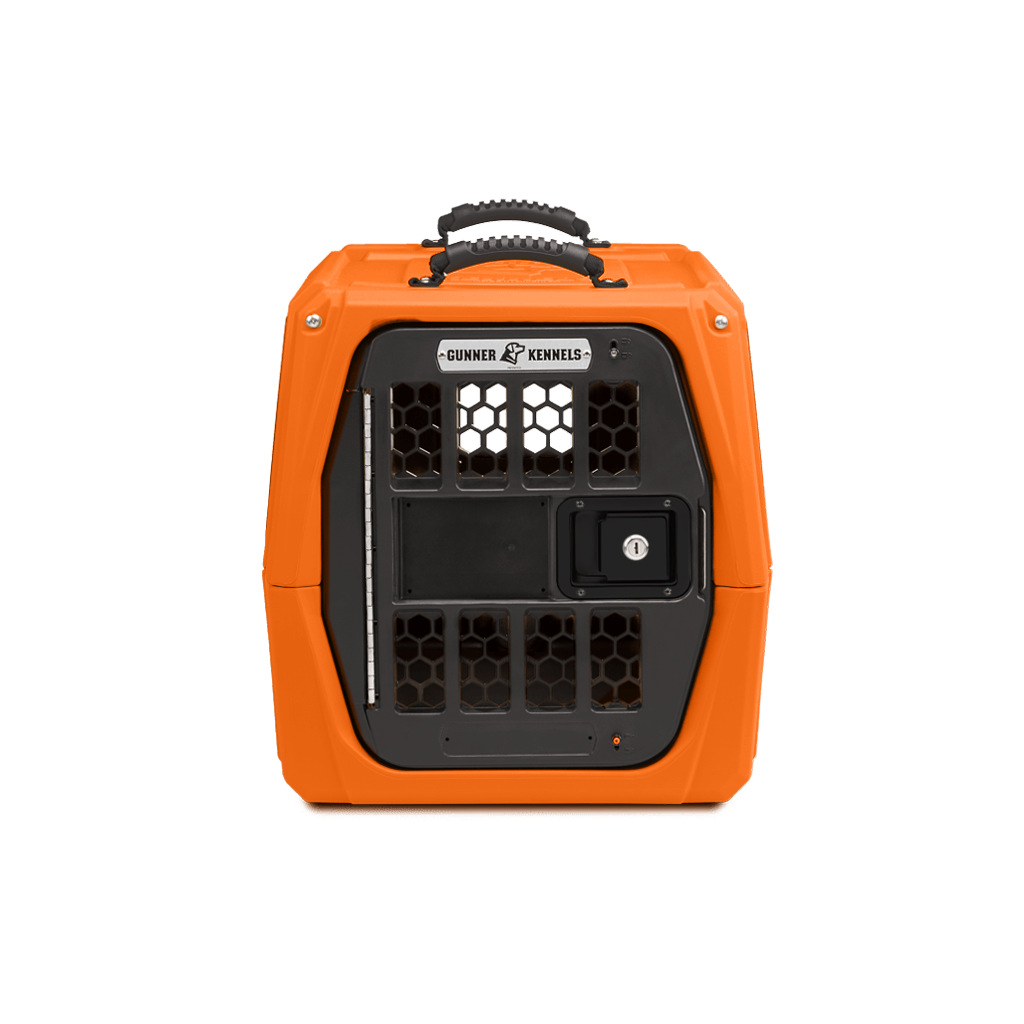 Bright orange, hard-sided dog crate with a black, ventilated front door, sturdy handle on top, and Gunner Kennels branding above the latch, set against a plain white background—ideal for keeping your hunting dog secure.