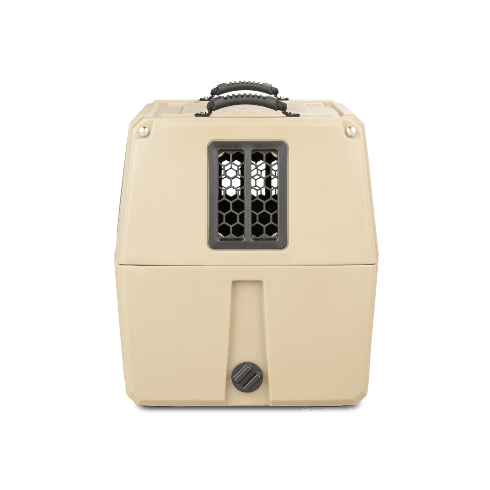 The GUNNER G1™ KENNEL - TAN is a double-walled dog crate with shock protection, secure latch, black handle, vented window for airflow, and a textured design—providing the safest travel experience for your pet.