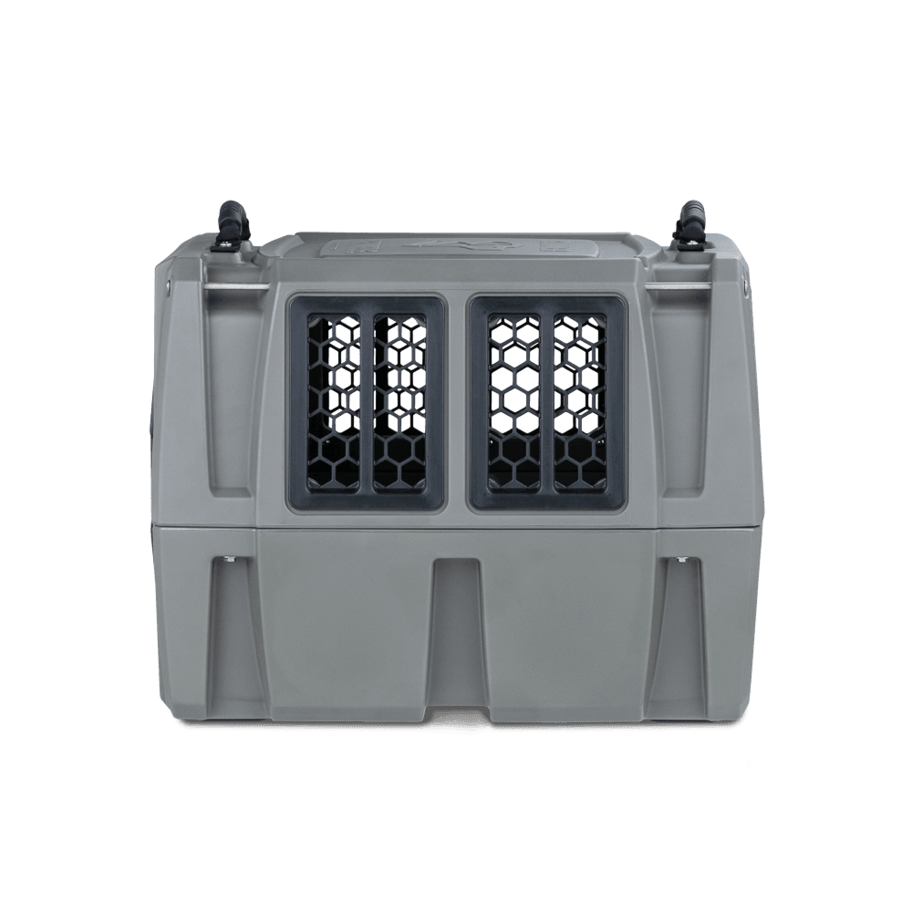 The GUNNER G1™ KENNEL in gunmetal is a durable, hard-shell pet crate with front ventilation grilles and sturdy top handles, designed for safely transporting animals.
