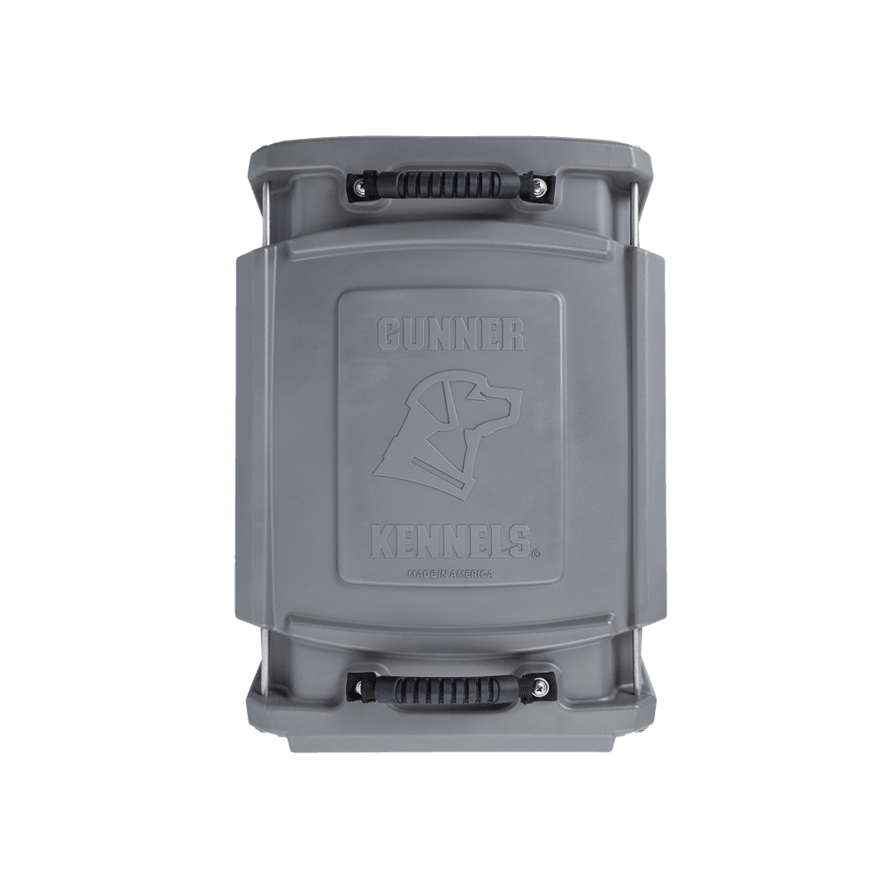 The GUNNER G1™ KENNEL - GUNMETAL lid is a gray plastic top with black handles, embossed with a dog head and GUNNER logo, crafted for a durable dog crate.