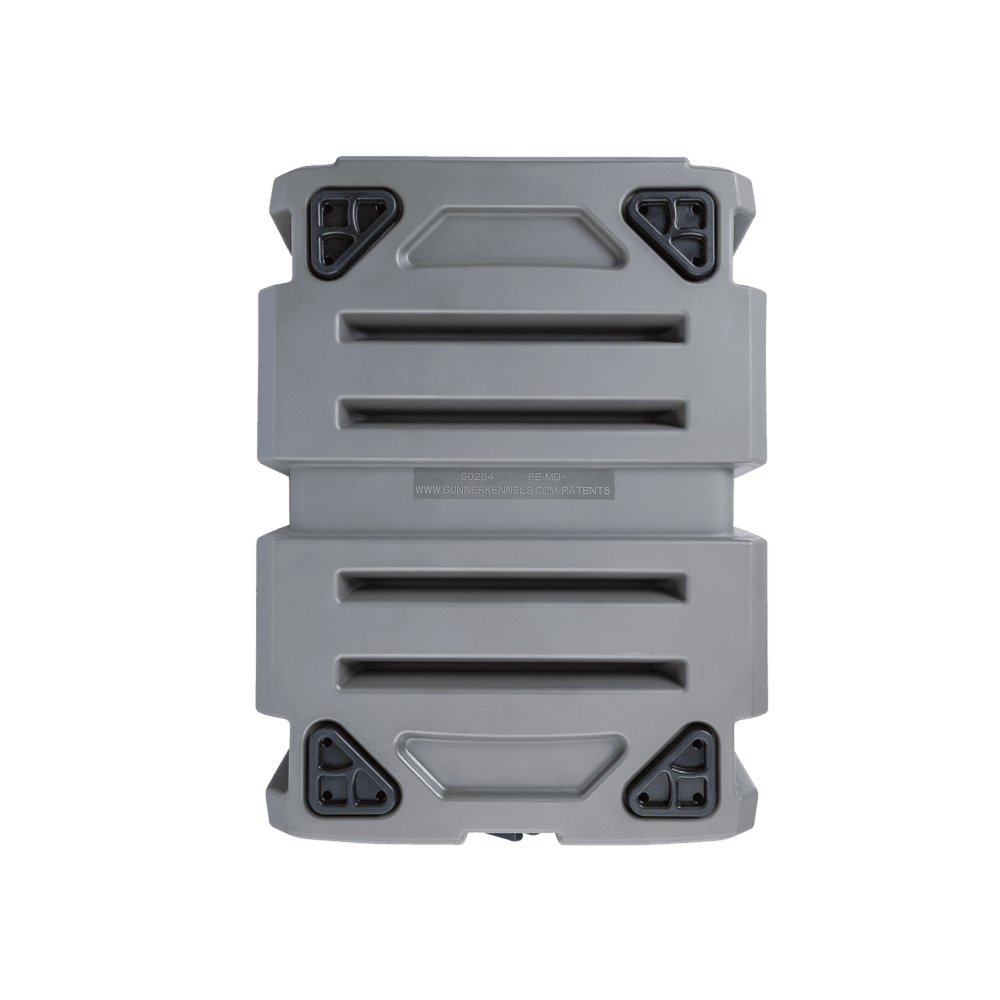 The GUNNER G1™ KENNEL - MOSSY OAK BOTTOMLAND GUNMETAL is a rectangular, gray hard plastic case with four black latches and textured ridges, built tough for secure, reliable storage like a dog crate.