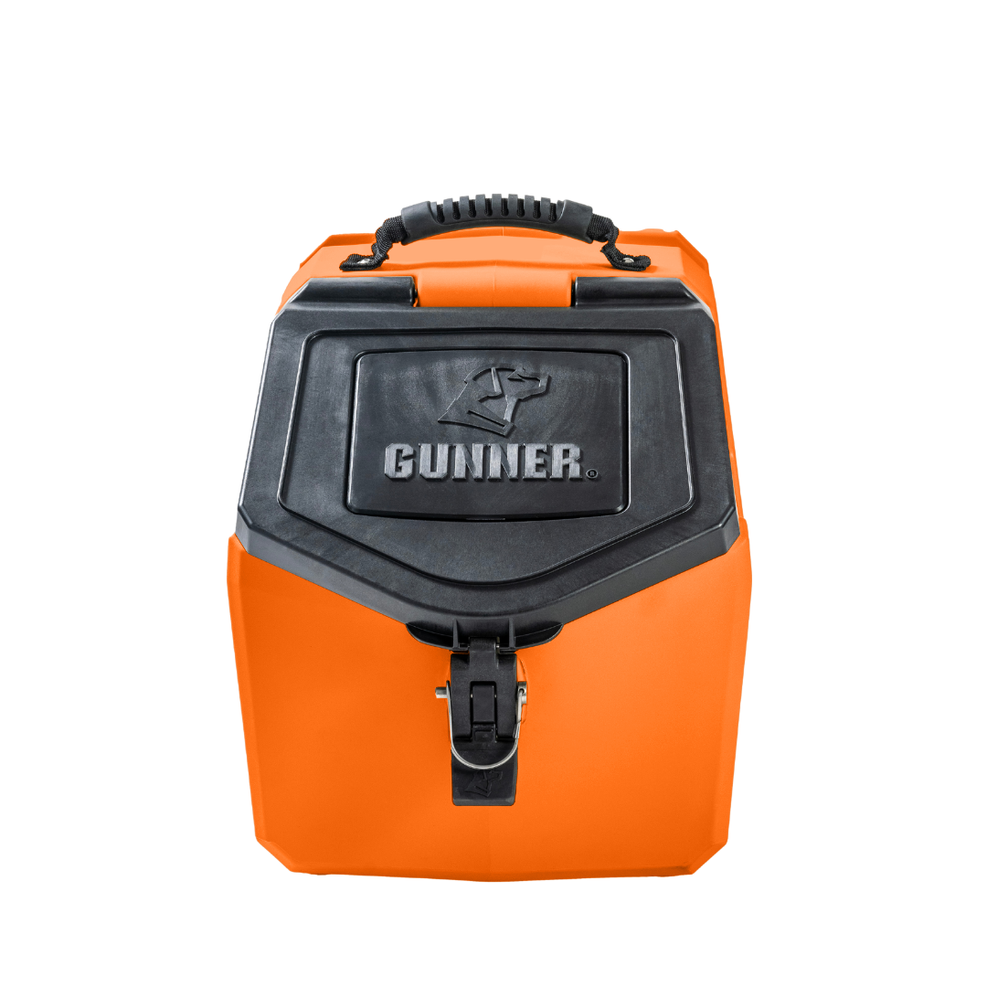 The GUNNER FOOD CRATE - BLAZE ORANGE by GUNNER is a bright orange hard-sided pet carrier with a black handle, black latch, and front compartment GUNNER logo, inspired by the limited-edition Color Fetch storage container. Shown on a plain white background.