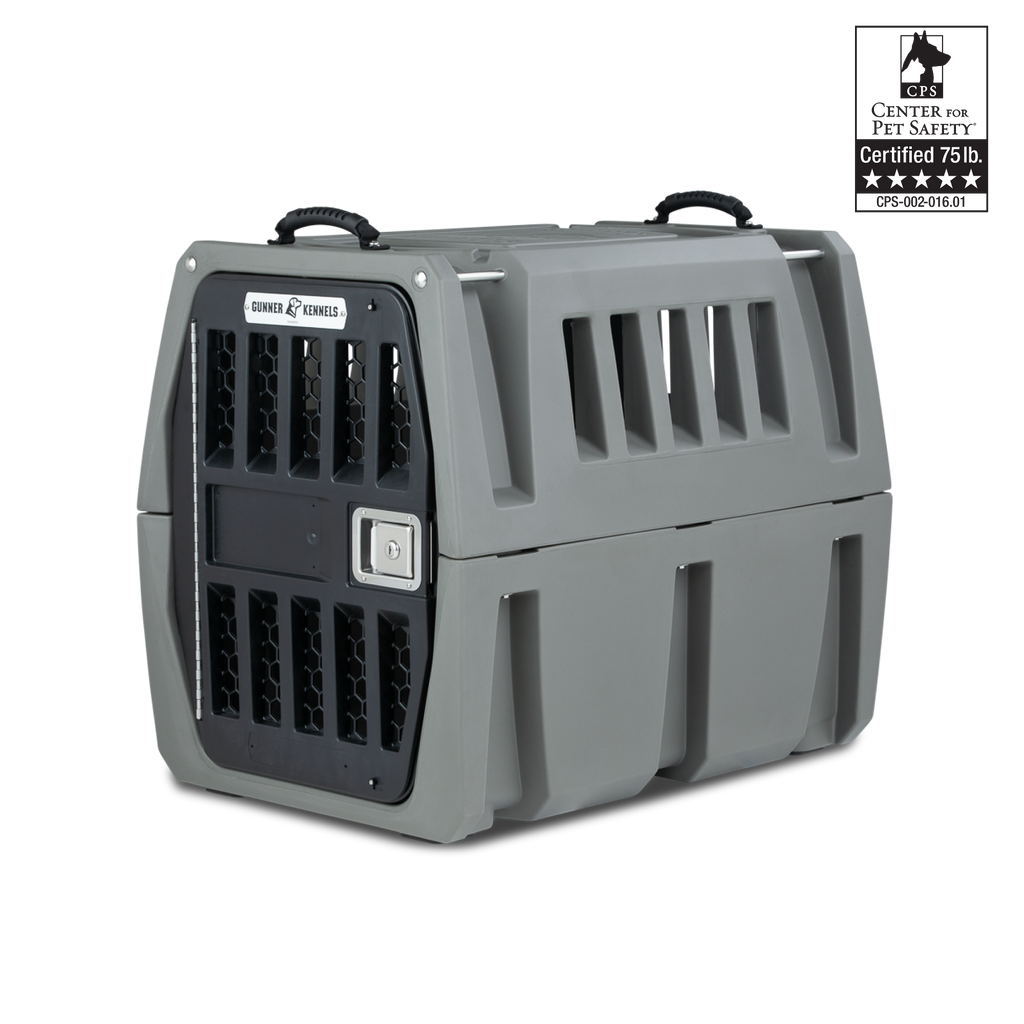 A sturdy gray dog crate with ventilation slats, black handles, and a secure metal door—perfect for your hunting dog. A label reads “Center for Pet Safety Certified 75 lb.” with a five-star rating.