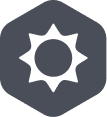 A dark hexagonal icon with a white sun symbol in the center, featuring a circular core and pointed rays—perfect for representing outdoor gear or hunting dog accessories.