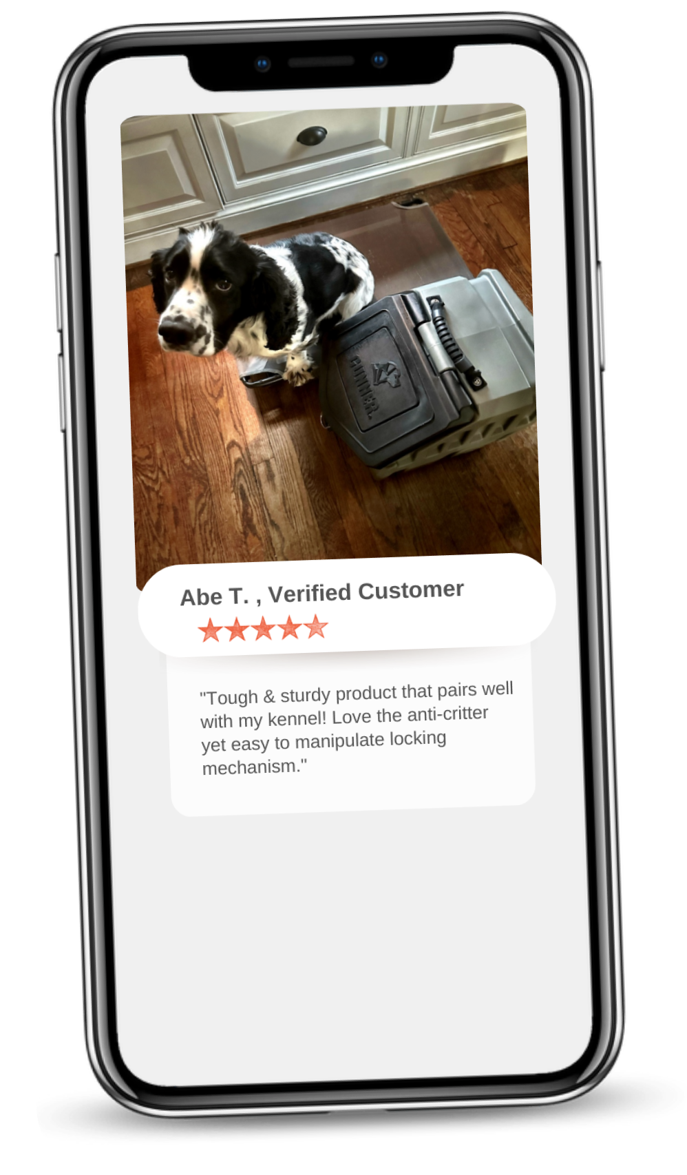 A black and white hunting dog sits beside a large gray dog crate with two sturdy locks, as seen on a smartphone screen displaying a customer review with a five-star rating.