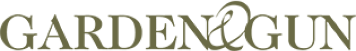 The logo displays the words GARDEN & GUN in uppercase serif font, with an elegant ampersand connecting the two words—an ideal emblem for hunting dog enthusiasts. The text is olive green on a light background.