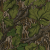 A close-up of a camouflage pattern featuring green leaves and brown tree branches with textured bark in the background. This design mimics natural foliage for concealment, ideal for a hunting dog or working dog in woodland environments.