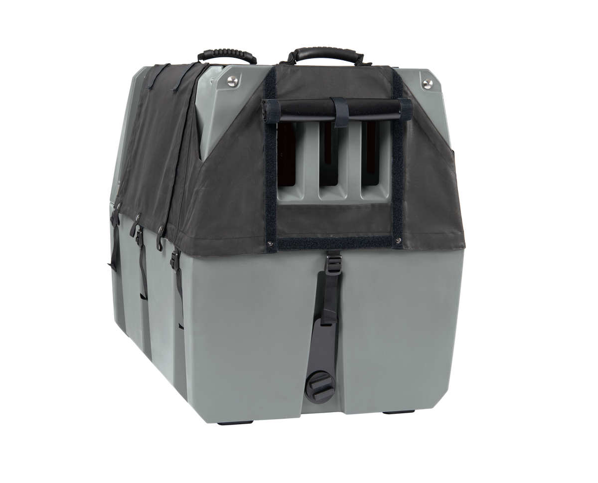 A spacious, gray and black pet crate from GUNNER with a durable plastic body, ventilation slats, top handle, and secure latches; compatible with the GUNNER ALL-WEATHER KIT 2.0 for UV protection—perfect for safe animal transport or housing.