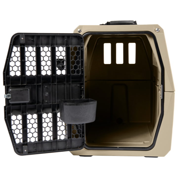 A beige and black G1 Kennel pet carrier features a hinged metal door with rectangular and honeycomb-shaped vents, revealing a spacious interior with a KENNEL BOWL near the entrance for dog hydration.